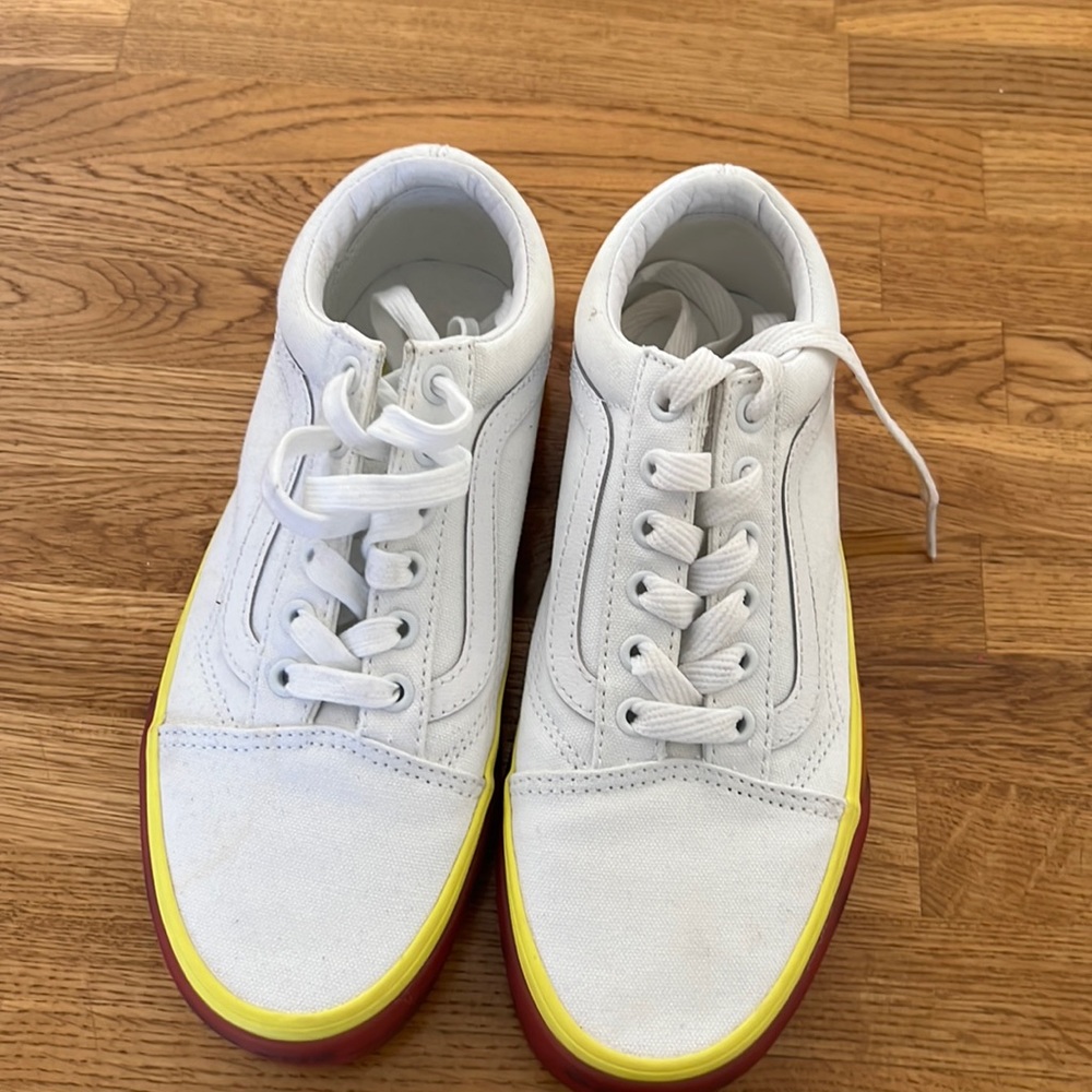 Vans white sneakers with yellow and orange sole. Lightly worn